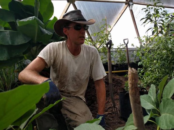 teacher in biodome greenhouse