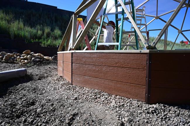installation of a foundation wall on a geodesic greenhouse