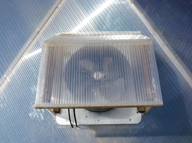 fan shroud on the outside of greenhouse