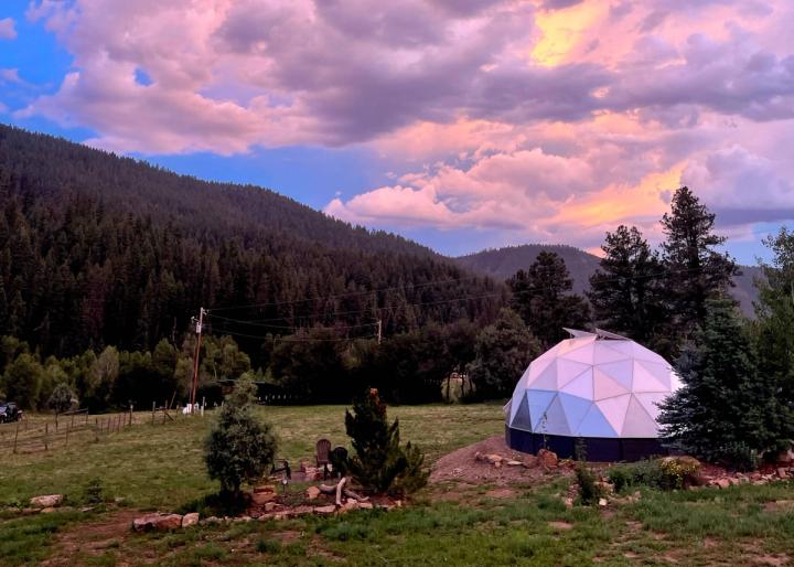 Backyard Greenhouse in Pagosa Springs Colorado under a beautiful purple sunset