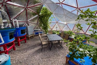 Aquaponics system in a Growing Dome greenhouse