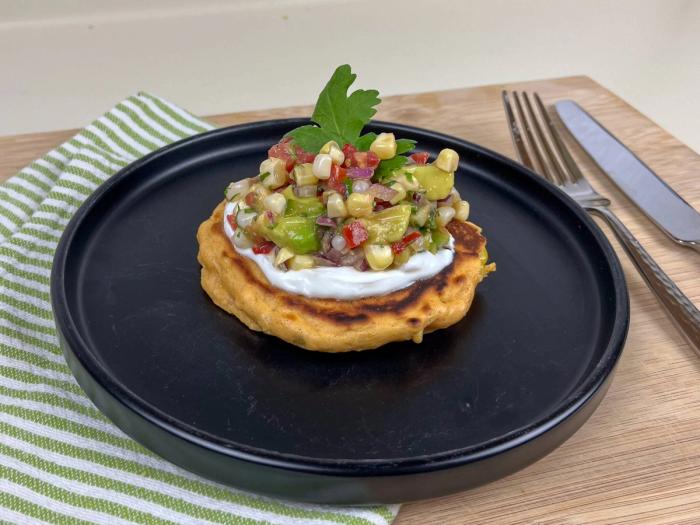 Roasted green chili corn cake topped with fresh corn salsa