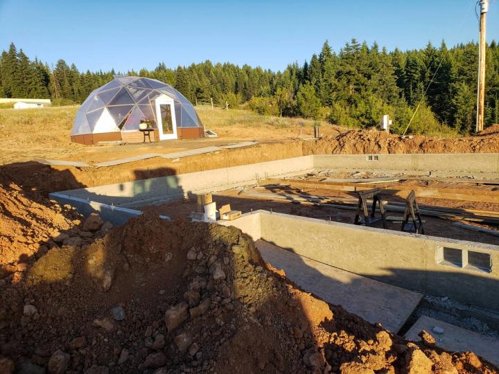 Building their backyard greenhouse and retirement home