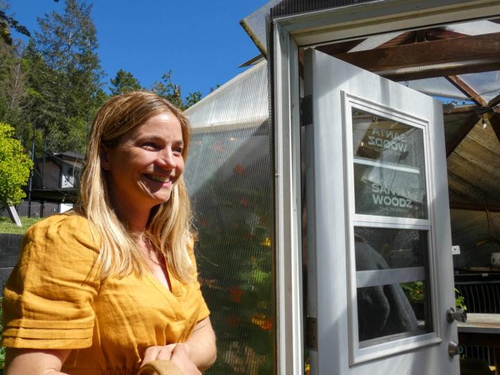 Woman in Yellow Dress Standing in Doorway of 18' Growing Dome
