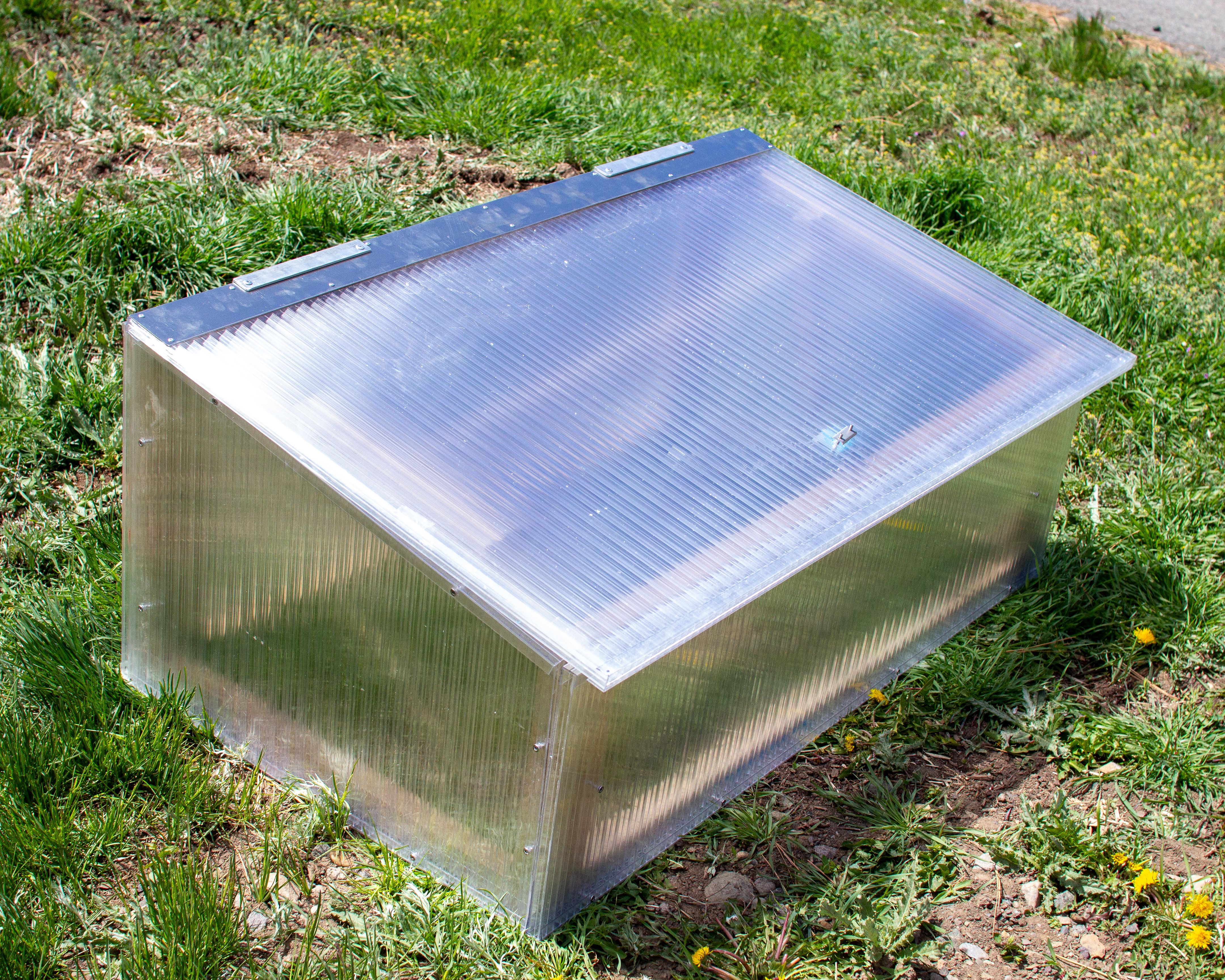 Polycarbonate cold frame on the grass