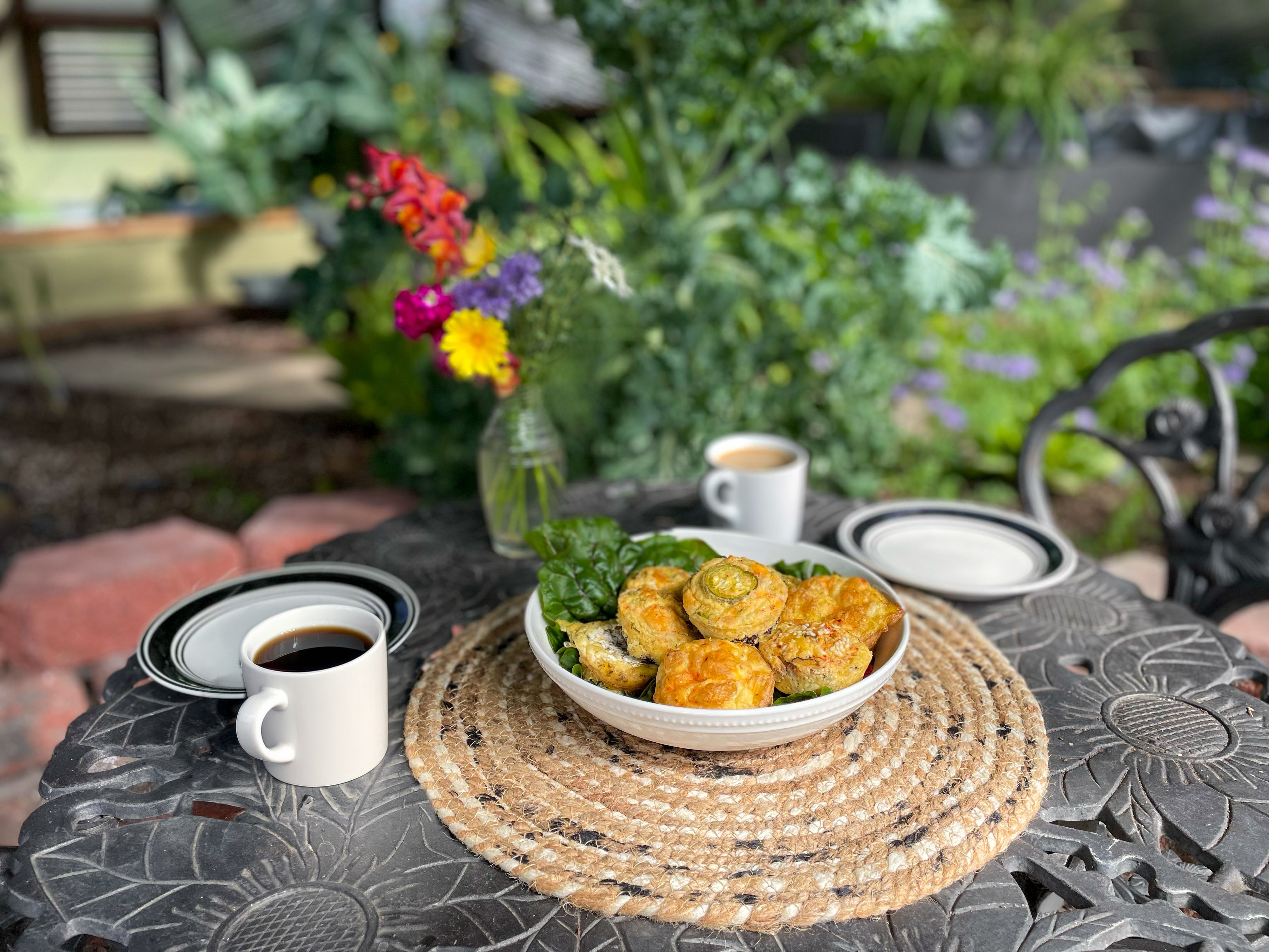 table set with breakfast egg bites in a garden greenhouse