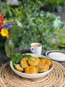 table set with breakfast egg bites in a garden greenhouse