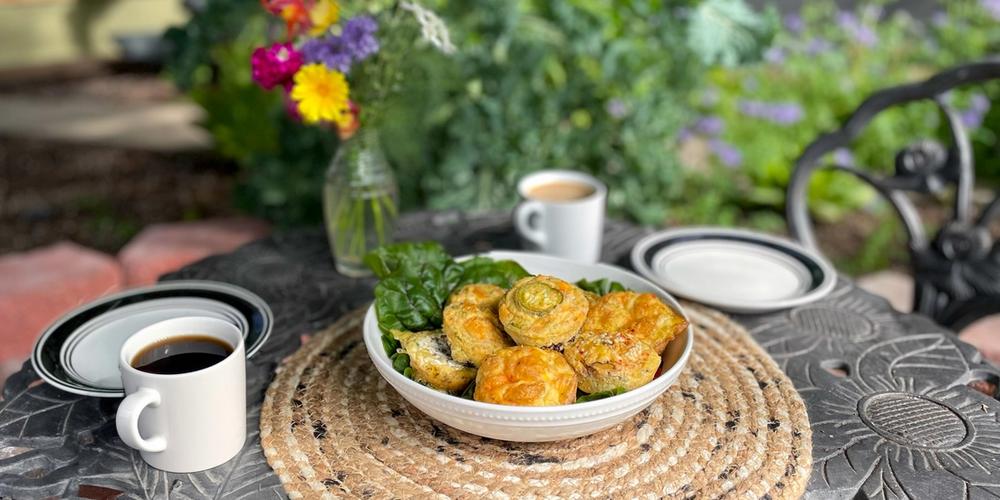 table set with breakfast egg bites in a garden greenhouse