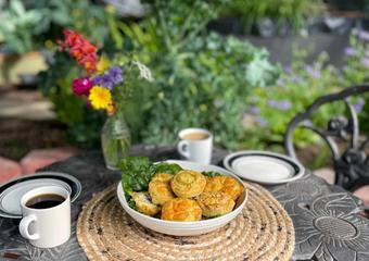 table set with breakfast egg bites in a garden greenhouse