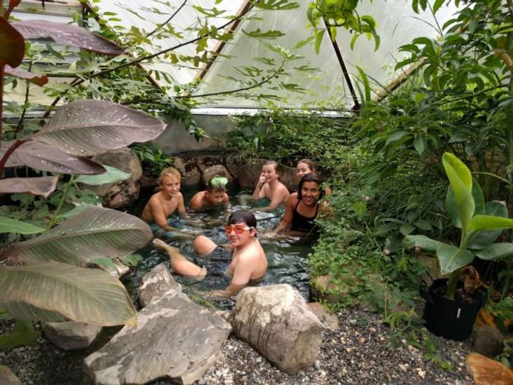 students in tropical greenhouse