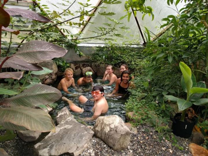 students in tropical greenhouse
