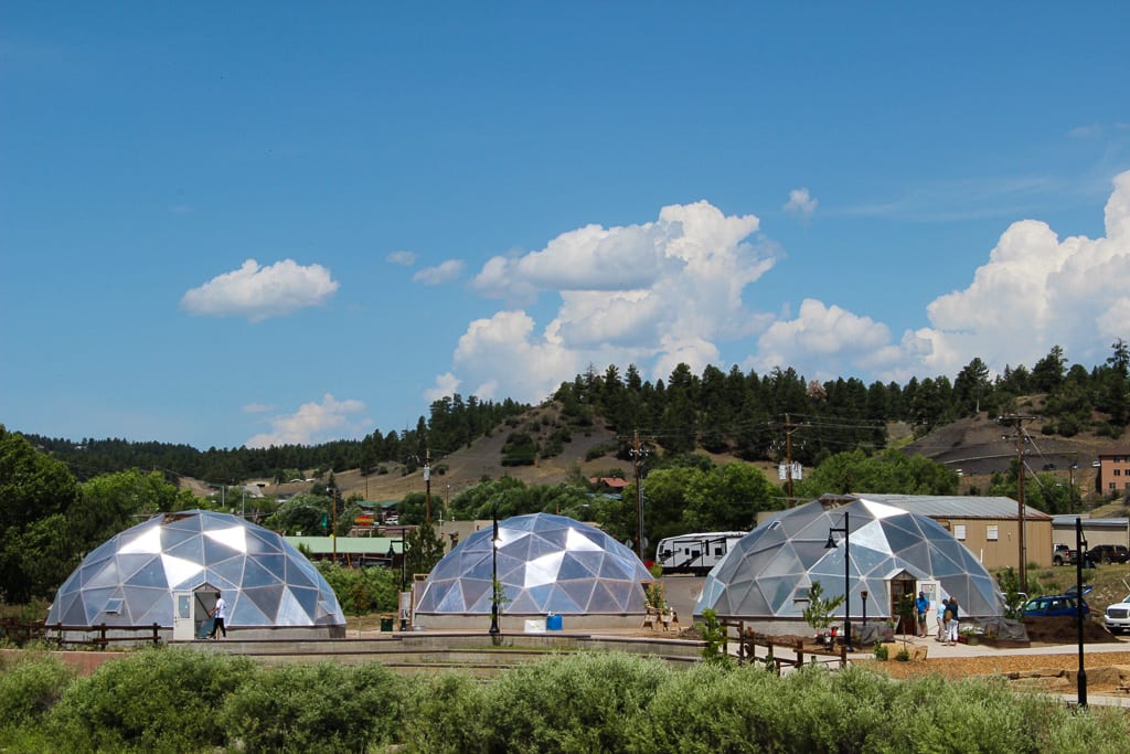 three growing dome greenhouses at the Geothermal Greenhouse Project in Pagosa