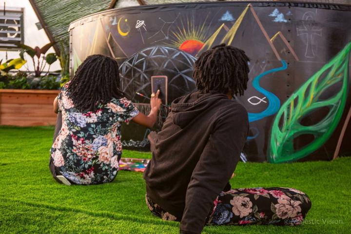 people drawing in the prolific oxygen dome