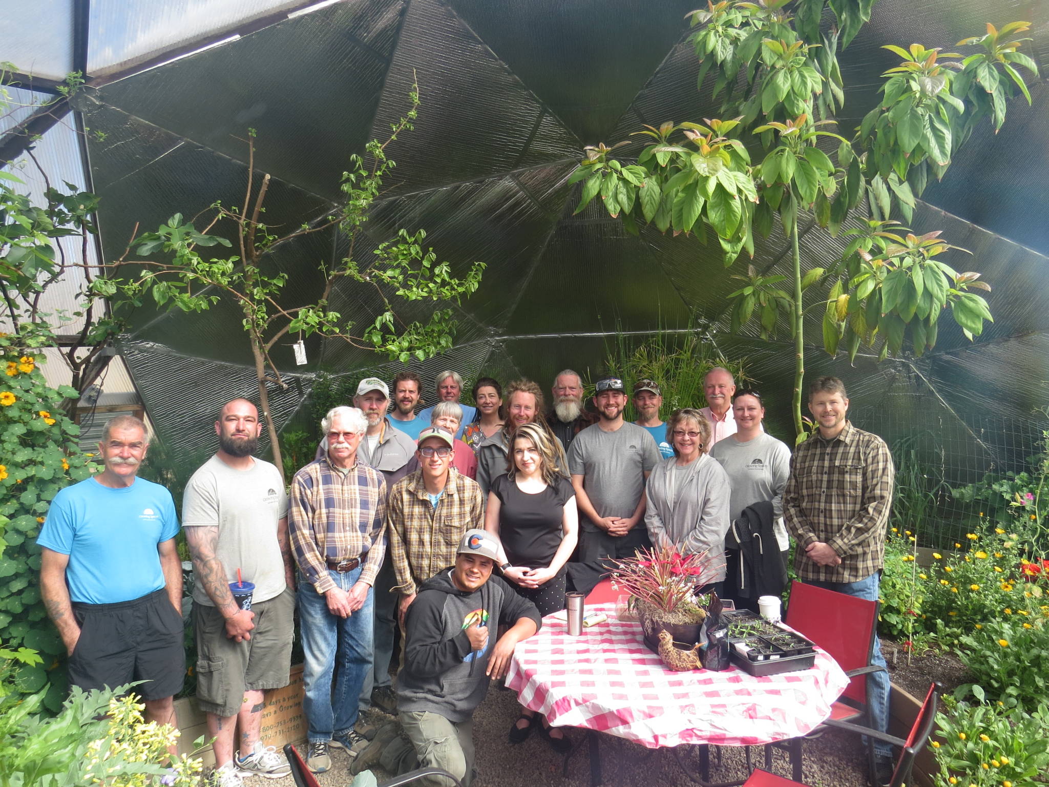 the Growing Spaces team with Lem Tingley in a Growing Dome greenhouse at the time of the change of ownership