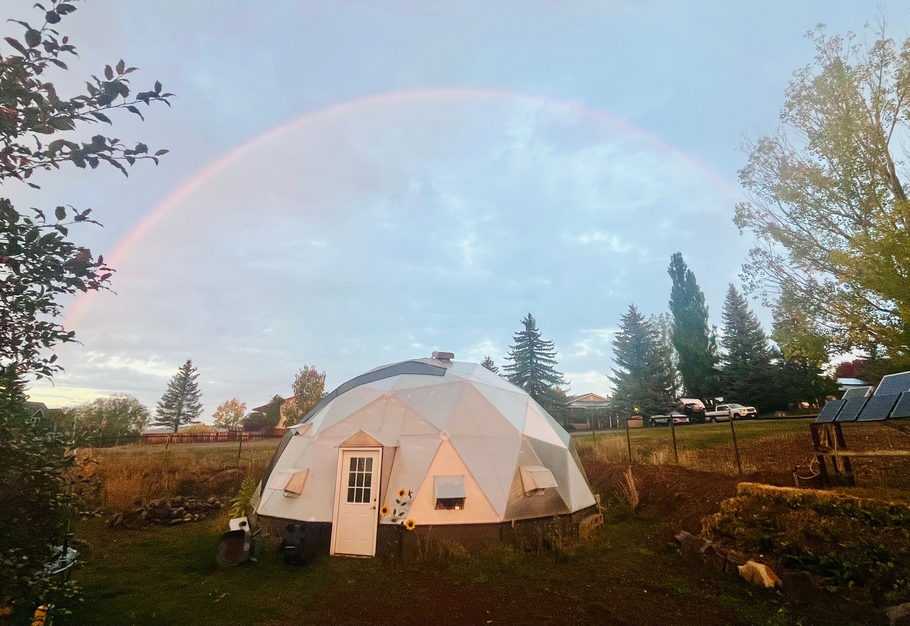 full rainbow over a 33 foot diameter Growing Dome greenhouse
