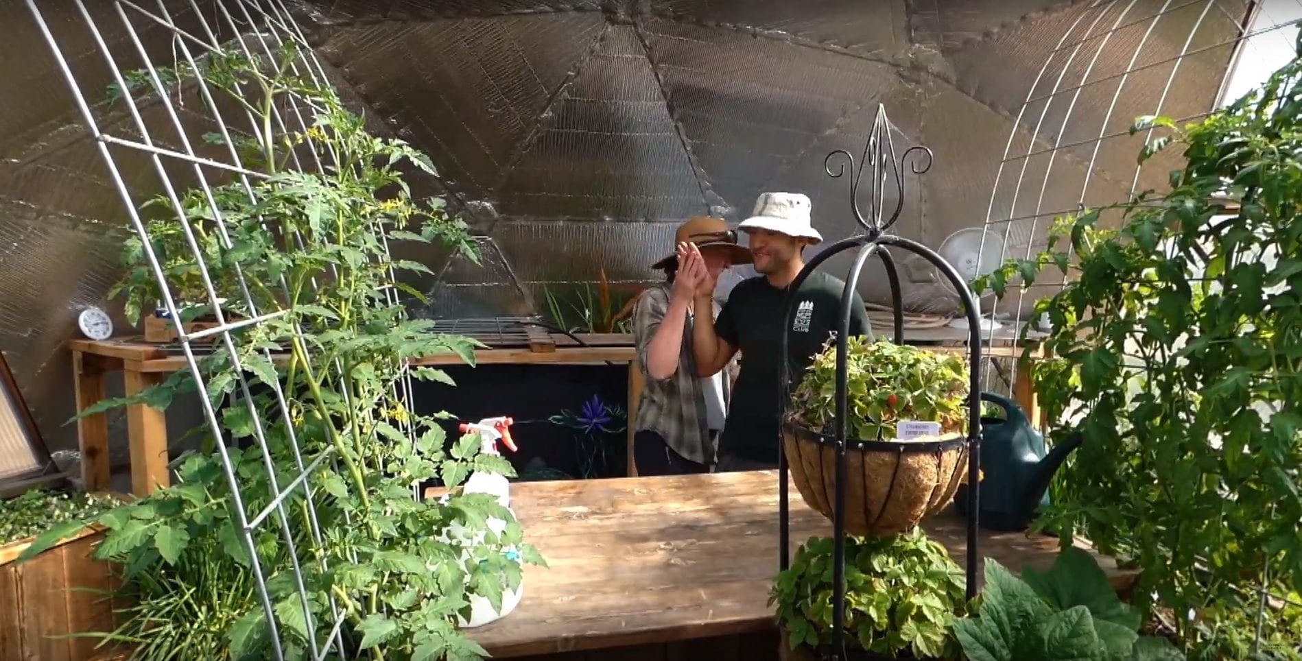 Pine River Garden Club members inside a Growing Dome greenhouse