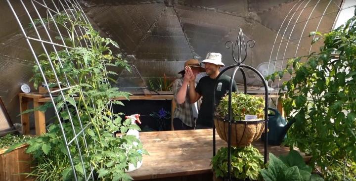 Pine River Garden Club members inside a Growing Dome greenhouse