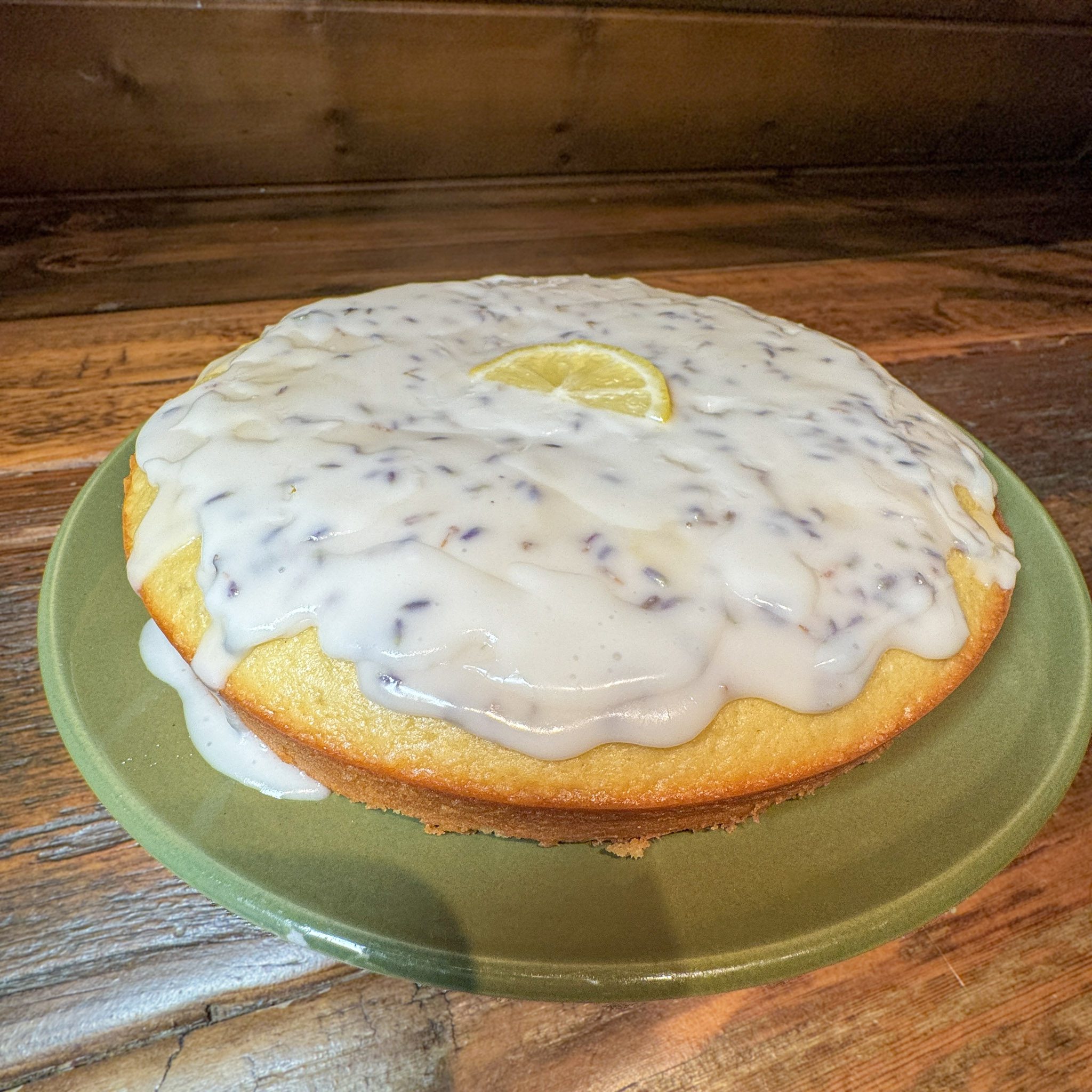 plated lemon olive oil cake with lemon garnish