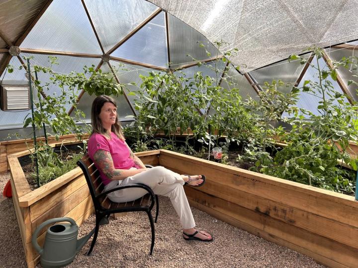 Jessica relaxing in the Growing Dome greenhouse for veterans at the Valor Point Domiciliary