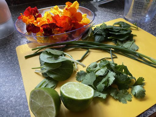 cutting up fresh greens for spring rolls
