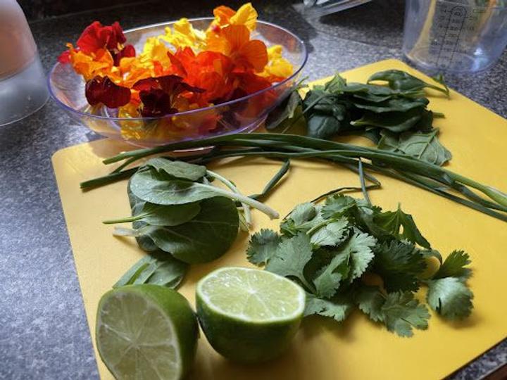 cutting up fresh greens for spring rolls