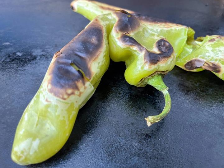 Roasted Hatch chili on flat-top grill