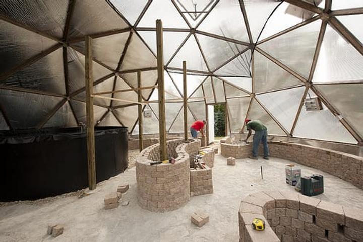 Building interior raised garden beds in a greenhouse
