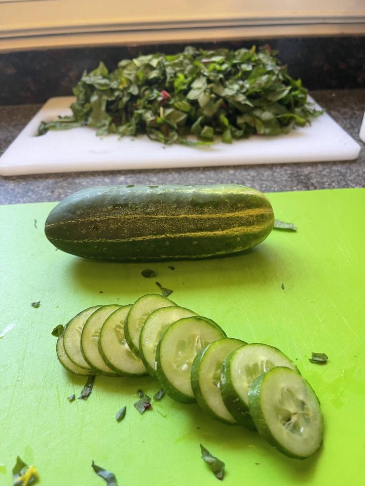 chopping the cucumber