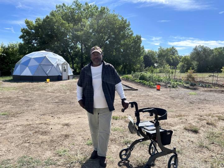 John outside the Growing Dome greenhouse for veterans at the Valor Point Domiciliary