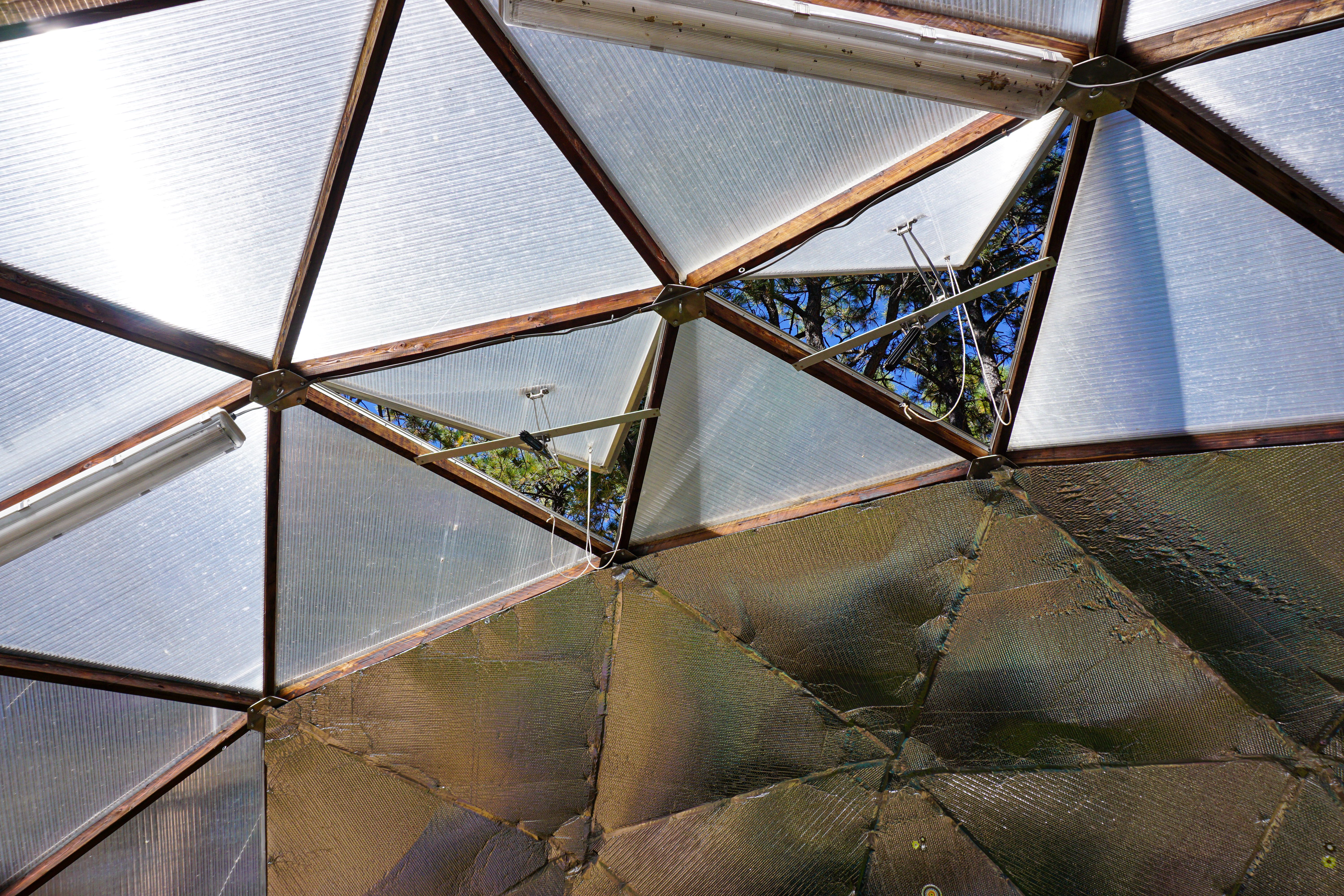 gigavent automatic vent openers opening upper vents on a geodesic dome greenhouse