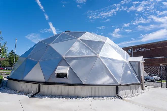 Garfield County School 42 foot diameter growing dome greenhouse with gutter system and concrete foundation