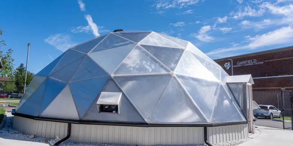 Garfield County School 42 foot diameter growing dome greenhouse with gutter system and concrete foundation