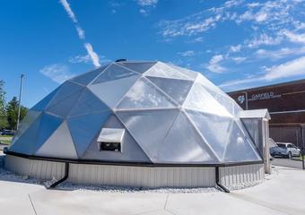 Garfield County School 42 foot diameter growing dome greenhouse with gutter system and concrete foundation