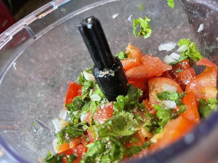 cilantro onions and tomatoes in a food processor