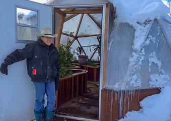 Josie showing our 18 foot Growing Dome Greenhouse