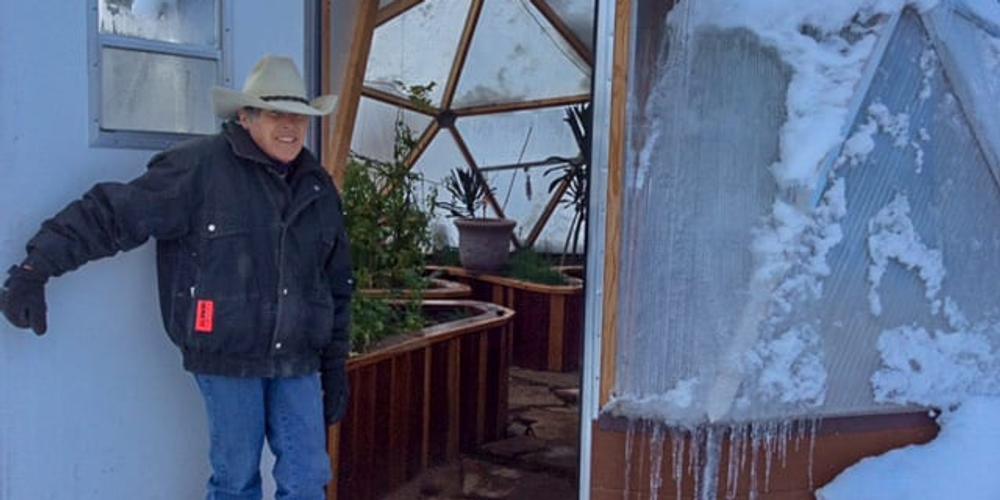 Josie showing our 18 foot Growing Dome Greenhouse