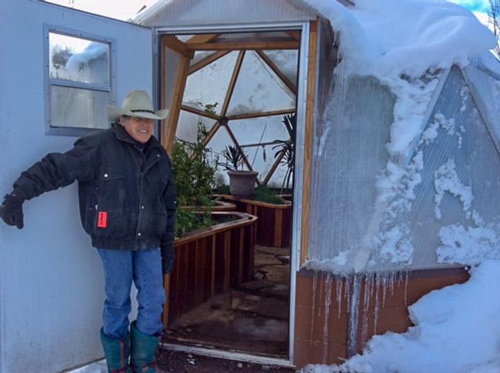 Josie in front of our 18′ Growing Dome at the Pagosa Springs Headquarters