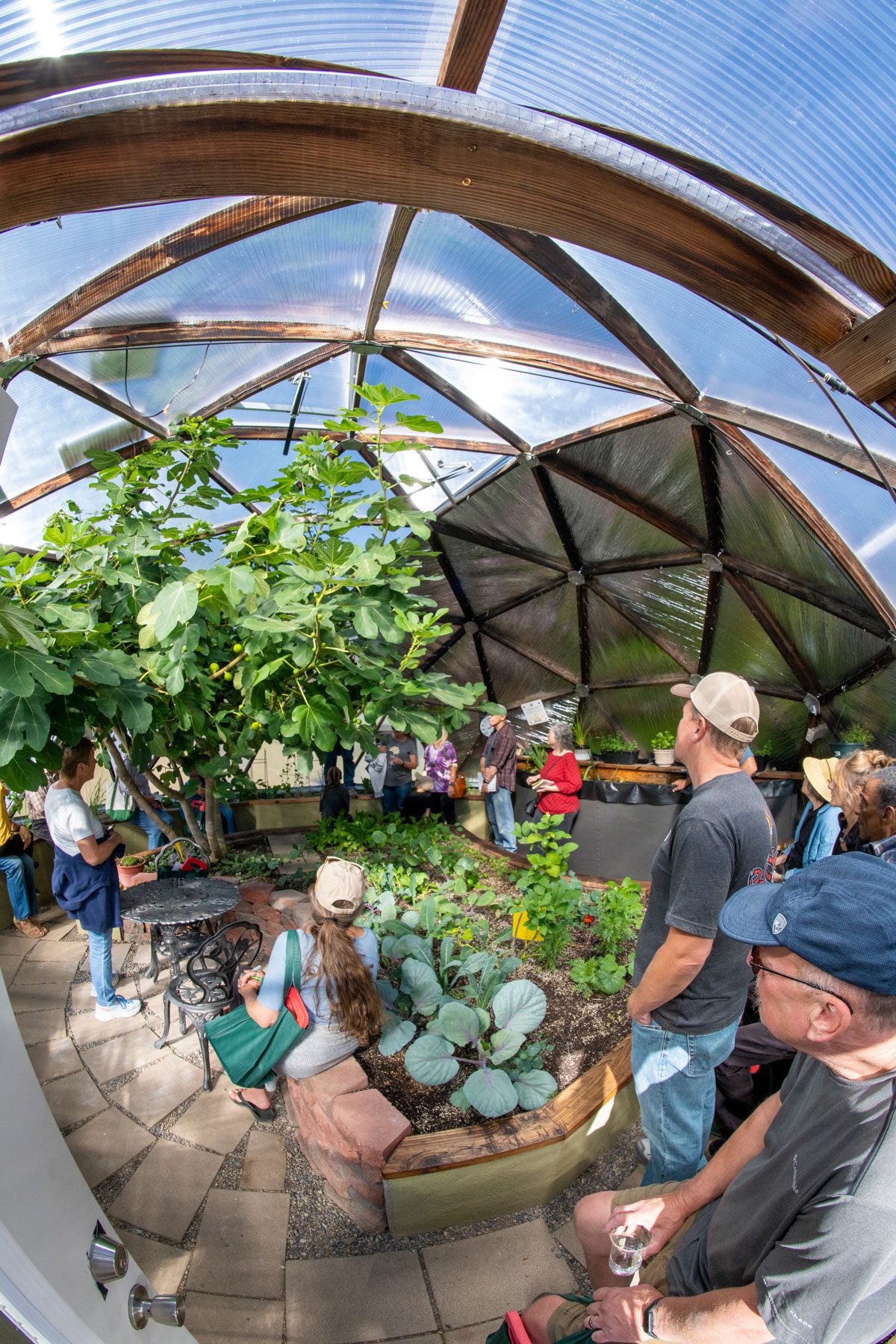 people touring a growing dome