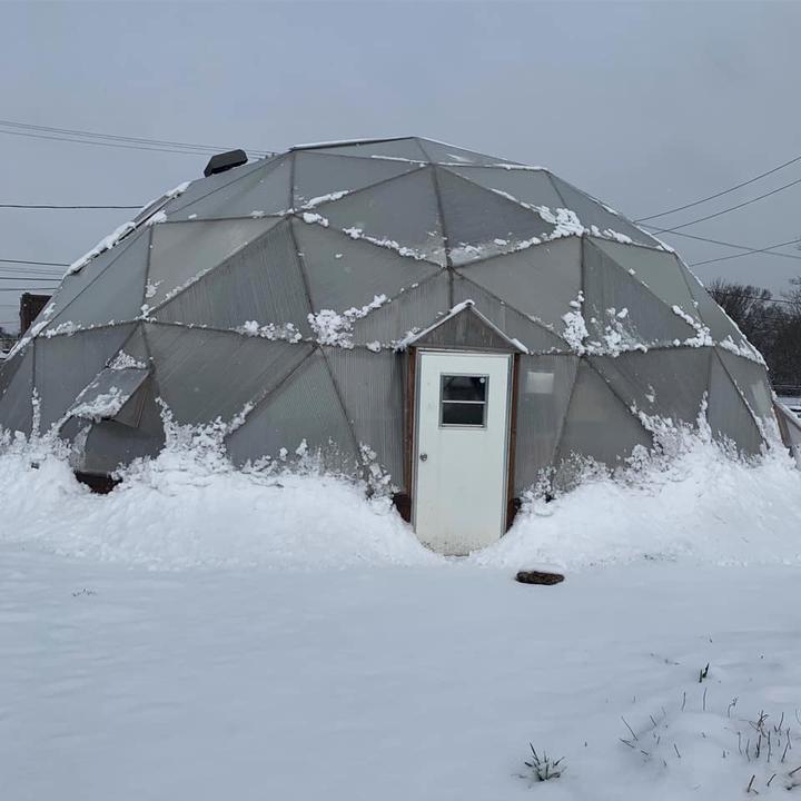 Growing Dome greenhouse covered in snow