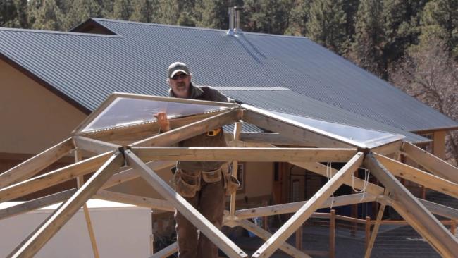 Matt Deguise installing the top vent on a 26' Growing Dome Greenhouse.