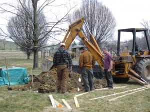 Volunteers digging for greenhouse utilities