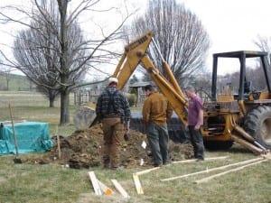 Volunteers digging for greenhouse utilities