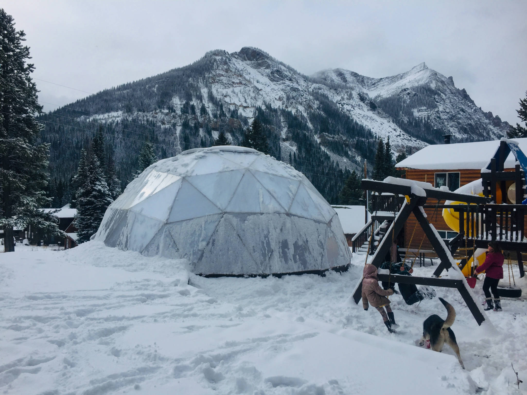 Growing Dome greenhouse in the Montana mountains covered in frost