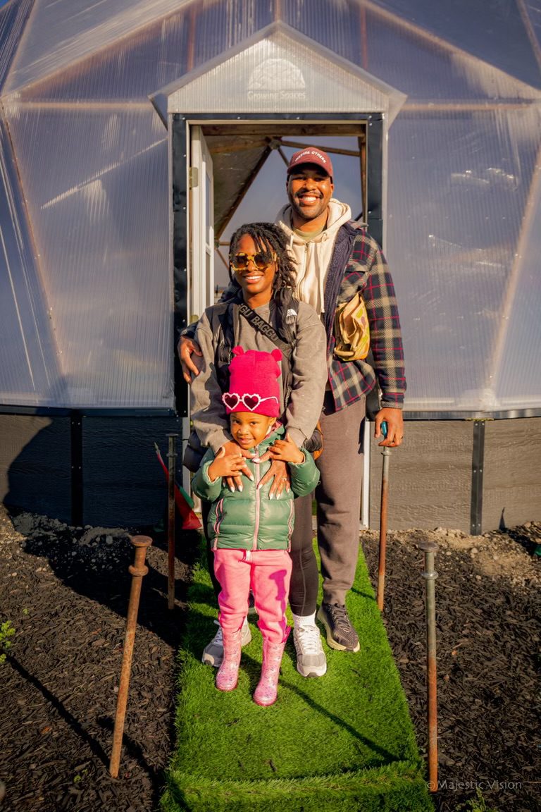 Family standing at the entrance of the Prolific Oxygen Growing Dome in Cleveland, Ohio