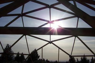 sunlight through the frame of a Growing Dome greenhouse