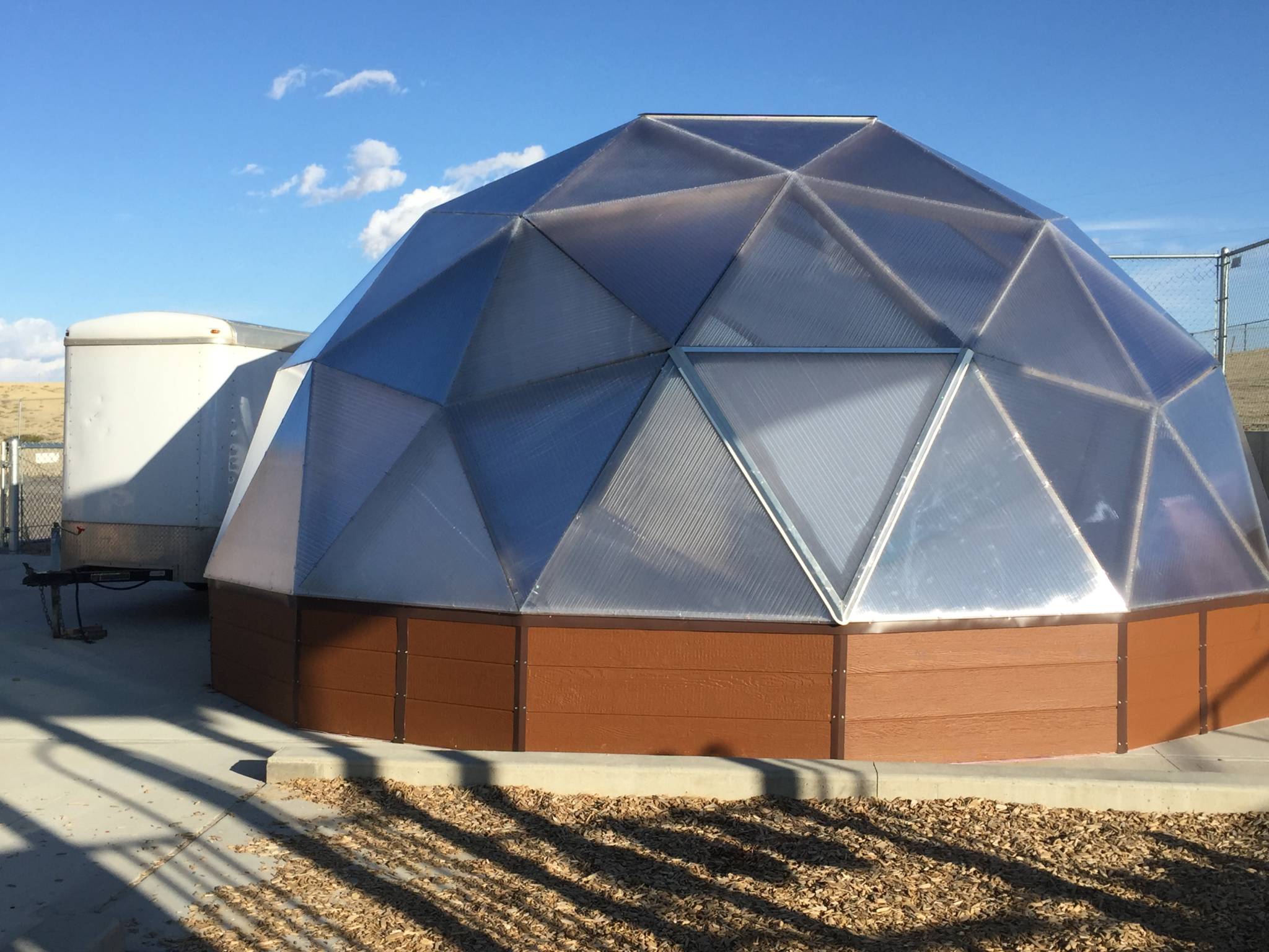 Exterior of a Growing Dome insulated foundation wall with LP SmartSide siding