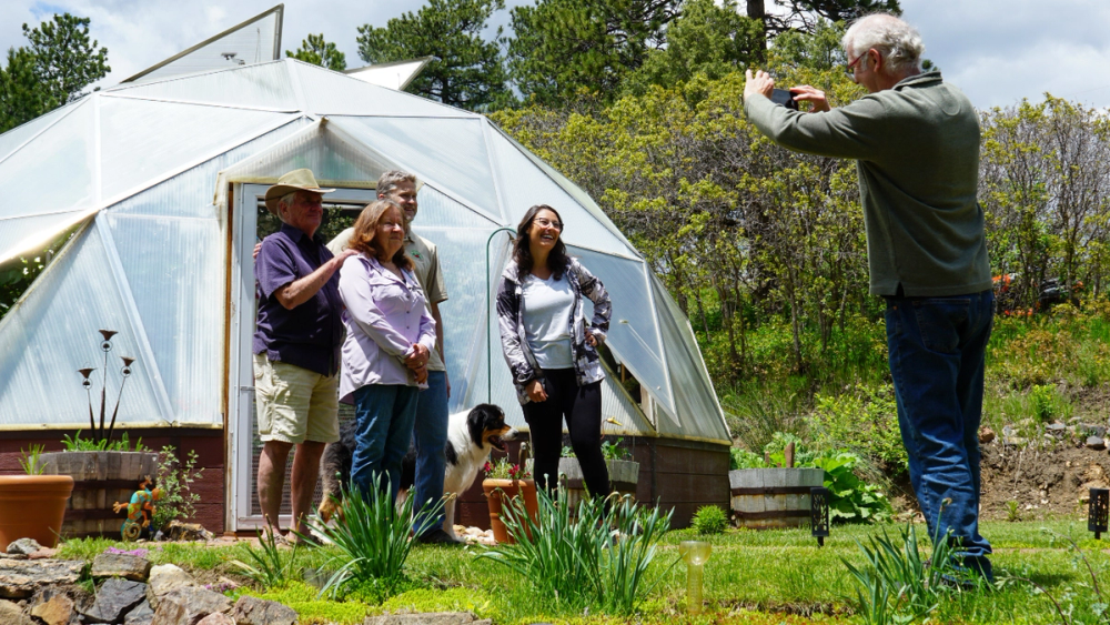 Customers Posing for a Photo Outside their Growing Dome Greenhouse