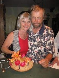Puja and Udgar Parsons posing with a cake