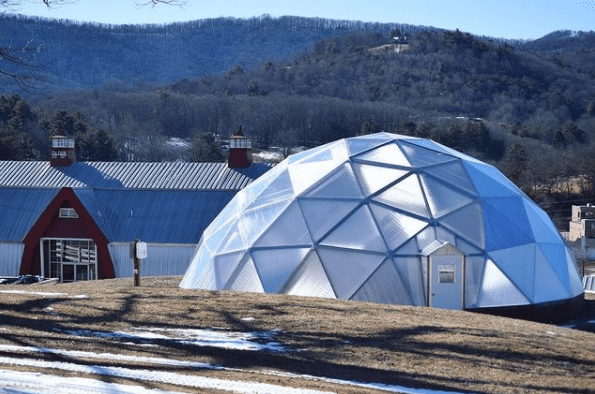 Eliada Homes' 42-foot Growing Dome on a hillside in Asheville, North Carolina