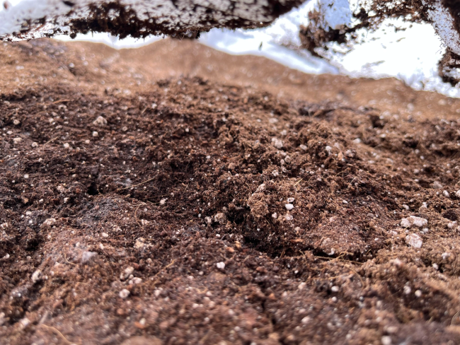 Freshly opened white tote of soil with perlite